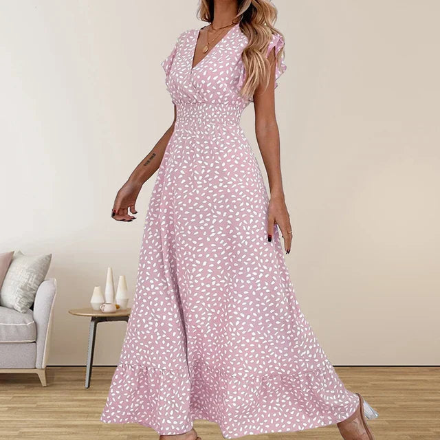 Robe longue élégante sans manches avec décolleté en v et finitions volantées